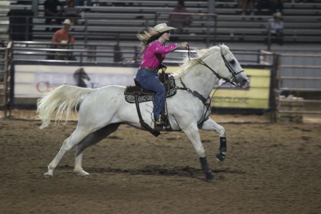 Megyn Alls of Shawnee sprints from one barrel to the next during the International Finals Youth Rodeo opening night on July 6.