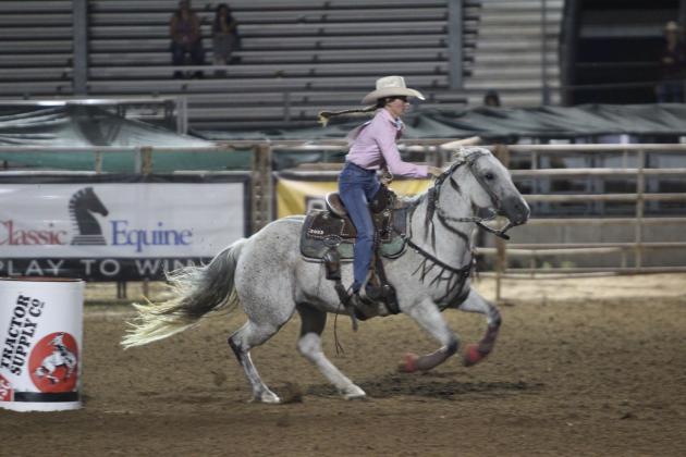 Brenna Beauchamp of Wanette races to the next barrel during the International Finals Youth Rodeo on the evening of July 7.