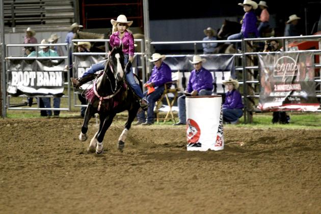 Brayle Miller of McLoud rounds the second barrel on her run at the International Finals Youth Rodeo, held at the Heart of Oklahoma Expo Center on the evening of July 8.