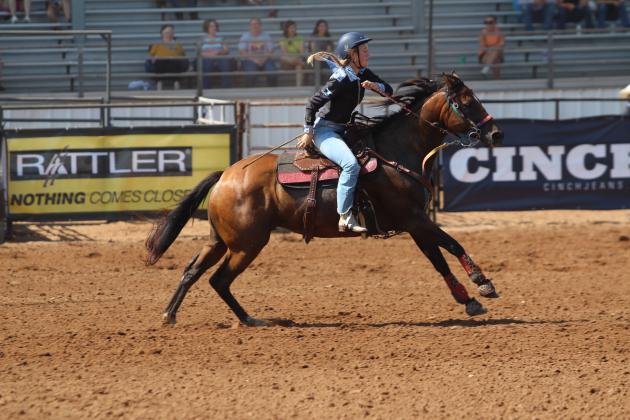 Jet Winn of Shawnee turns on the speed in barrel racing during the 33rd Annual IFYR, held at the Heart of Oklahoma Expo Center on the morning of July 8.