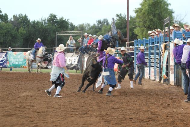 Darcy McDonald of Fort Worth, TX, does an unintentional handstand on his bull as he dismounts at the International Finals Youth Rodeo, held at the Heart of Oklahoma Expo Center on the evening of July 8.