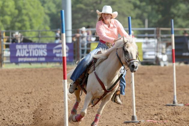 Danni Brown of Bethel competes in pole bending during the 33rd Annual IFYR, held at the Heart of Oklahoma Expo Center on the morning of July 8. Brown also competed in barrel racing and goat tying.