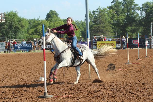 Brenna Beauchamp of Wanette weaves around poles during the 33rd Annual IFYR, held at the Heart of Oklahoma Expo Center on the morning of July 8.