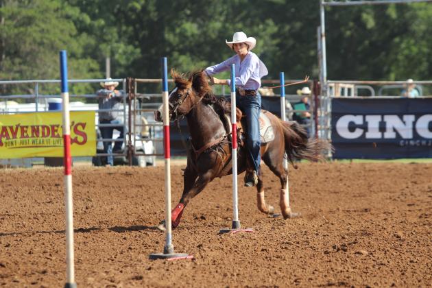 Bella Branham of Tecumseh and her horse keeps their eyes on the next pole during the 33rd Annual IFYR, held at the Heart of Oklahoma Expo Center on the morning of July 8.