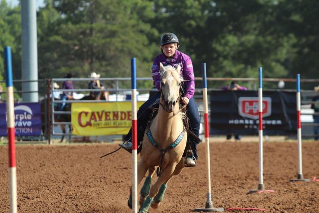 Macie Creevey of Augathella, Queensland, Australia, competes in pole bending during the 33rd Annual IFYR, held at the Heart of Oklahoma Expo Center on the morning of July 8.