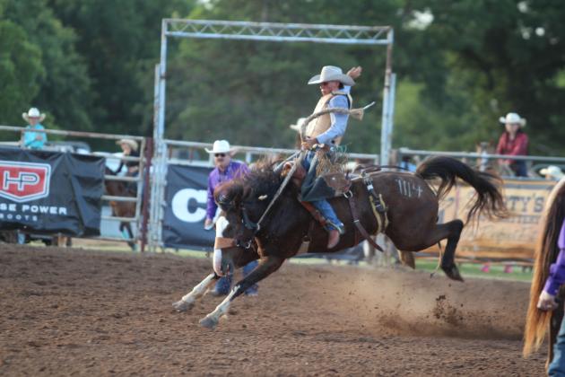 Kolt Mendenhall of Boswell, OK, competes in the saddle bronc event at the International Finals Youth Rodeo, held at the Heart of Oklahoma Expo Center on the evening of July 8.