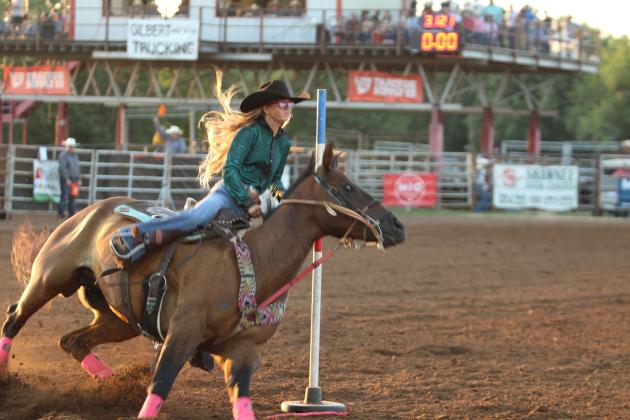 Kinzlee Jones of Shawnee rounds the end pole on her second run at the International Finals Youth Rodeo, held at the Heart of Oklahoma Expo Center on the evening of July 9. She also competed in the barrel racing.