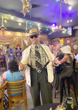 Celebrity Model, Dirk Engles, snaps the suspenders on his stylish outfit put together by Fran Topping.
