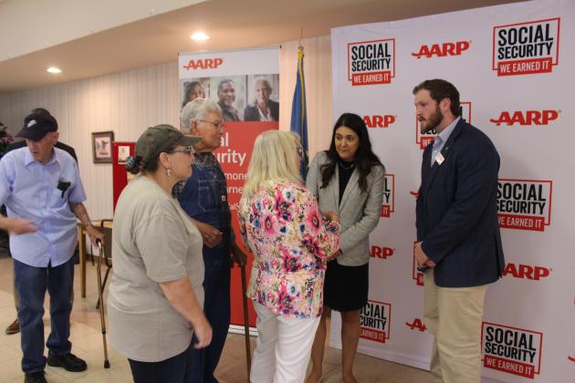 U.S. Representative Stephanie Bice and her aide Marlon Banner listen to Arthenia Haney at the Tecumseh Golden Age Center on Aug. 12 during the AARP Oklahoma celebration of Social Security's 90th anniversary.