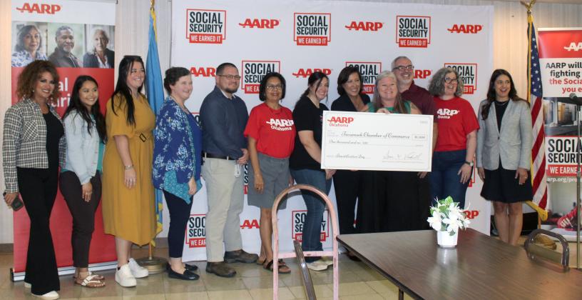 AARP Oklahoma presented a $1,000 check to the Tecumseh Chamber of Commerce in celebration of the 90th Anniversary of Social Security at the Tecumseh Golden Age Center in conjunction with Project HEART on Aug. 12. Shown, from left, are Candi Martin, Tara Wallace, Annie Jo Gilbert, Beth Lyle, Daniel Castaneda, Lisa Watson, Mashell Sourjohn with AARP, Chamber Executive Director Kimberly Elliott, Anthony LaGrange, Holly Gordon and U.S. Representative Stephanie Bice.