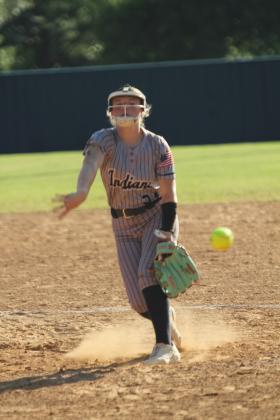 Asher junior Makaylee Harrell puts a spin on her pitch during the home game against Moss on Aug. 15. The Lady Indians played their first five fast pitch games of the season at home last week and won all but one. They beat Moss, 11-6.