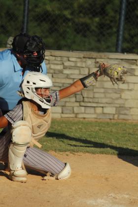 Asher freshman Amaya McFerran makes the catch during the third inning of the home game against Moss on Aug. 15. The Lady Indians played their first five fast pitch games of the season at home last week and won all but one. They beat Moss, 11-6.
