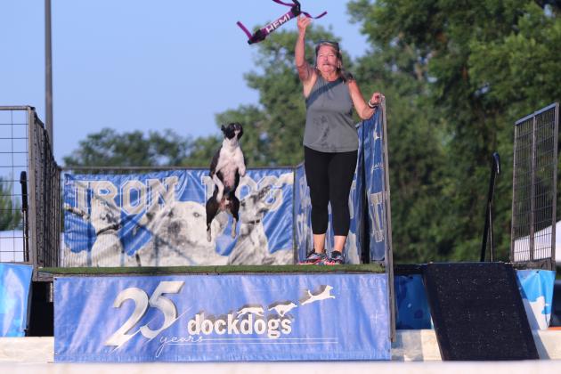 Helena Cudd throws a toy for Hemi during the DockDogs® competition at the FireLake Fireflight Balloon Festival on Aug. 9. Hemi won first in the Pro Finals with a 25-foot, seven-inch jump. This is the first year for the competition, which attracted contestants from all over Oklahoma and Texas.