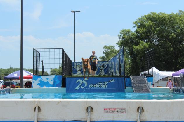Jaxson Patterson, 13, of Moore, competes in the Junior Handler division with Harlo during the DockDogs® competition at the FireLake Fireflight Balloon Festival on Aug. 9.