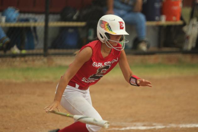 Earlsboro junior Payten Gentry drops her bat and runs for first during the home fast pitch game with New Lima on Aug. 11. The Lady Wildcats won, 10-0.