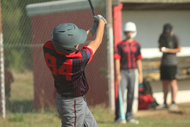 Earlsboro sophomore Cameron Black slams a single during the baseball game at Macomb on Aug. 14.