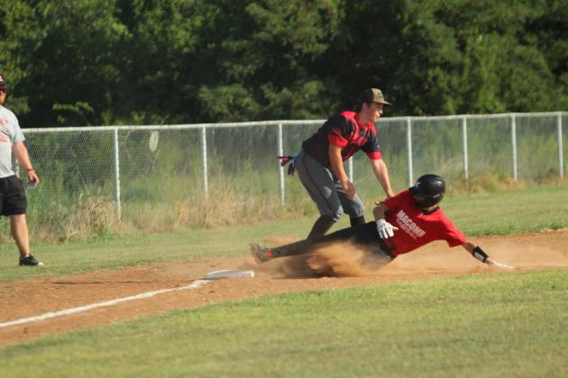 Earlsboro freshman Bentley Inman tags Macomb senior Radlee Blaine as he slides into third base during the baseball game at Macomb on Aug. 14.