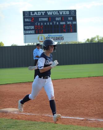 Shawnee's Jalee Reeves takes off from third to go home during the home game against Putnum City North on Aug. 22. The Lady Wolves won 7-5.