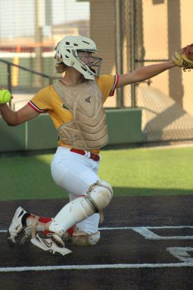 Dale junior Kinley Patten throws to the pitcher.