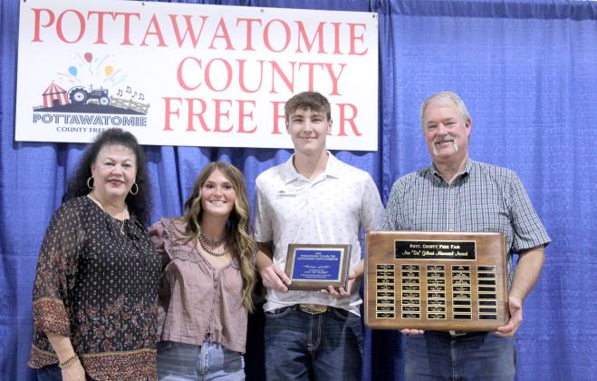 Braxton Robbins of Bethel received the Ann "Sis" Gilbert Memorial Outstanding Youth Exhibitor Award during the Pottawatomie County Free Fair Awards on Sept. 6. Shown, from left, are Suzanne Gilbert, former recipient Poppy Robbins, Robbins, and Fair Chairman Randy Gilbert.