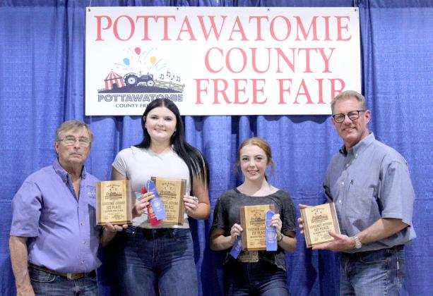 Jacee Townsend and Kimberly Holland of Tecumseh, along with Fair Board members Lynn Marlow and Rex Anderson, hold their plaques for first place in Livestock Judging - Senior FFA Team during the Pottawatomie County Free Fair Awards on Sept. 6.