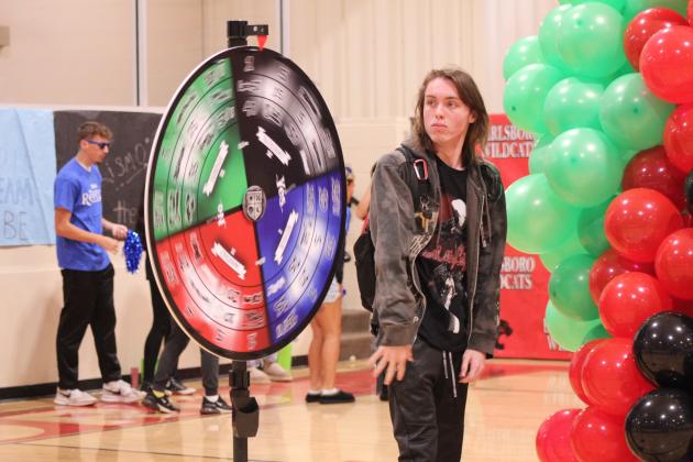 Earlsboro High School student Lucky Cole spins the wheel which will decide which "house" he'll represent this school year during the Sorting Ceremony on Sept. 2. In the past, Earlsboro has held sorting ceremonies for the elementary students, but this year, it includes all of their students and follows the Ron Clark Academy.