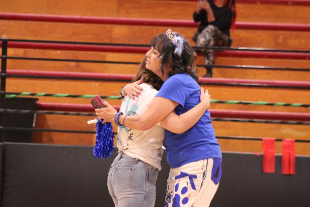 Earlsboro student Natalie Allen gets a hug from Stephanie Kleckner after joining the Reveur House during the Sorting Ceremony on Sept. 2. In the past, Earlsboro has held sorting ceremonies for the elementary students, but this year, it includes all of their students and follows the Ron Clark Academy.