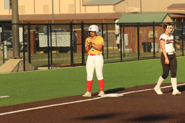 Dale senior Kaylyn Solis claps after she makes it to third.
