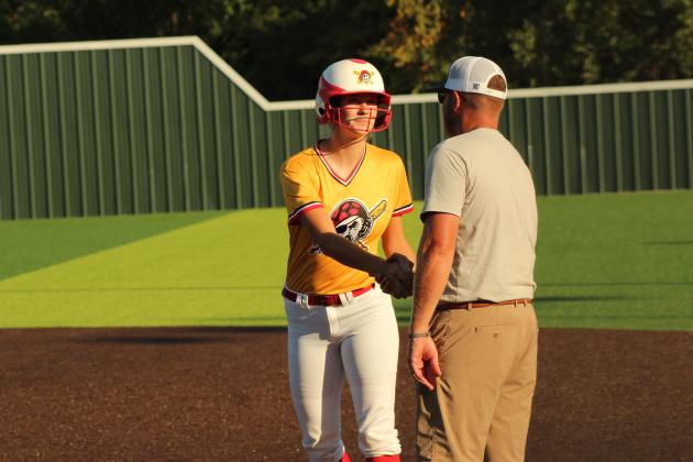 Dale junior Kinley Patten gets a handshake from the coach at first.