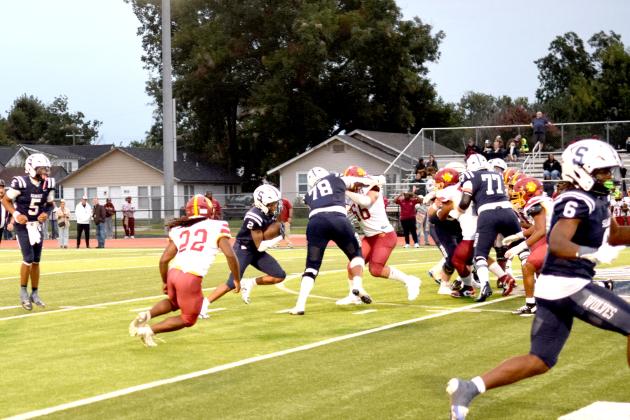 SHS's RB, Travion Barber II finds a hole in the Panther's defense.  The Shawnee Wolves won their season opener at home against PC North on Sept. 5 32-19 (last year PC North beat SHS 35-3 last season). Julie Talton, Countywide &amp; Sun