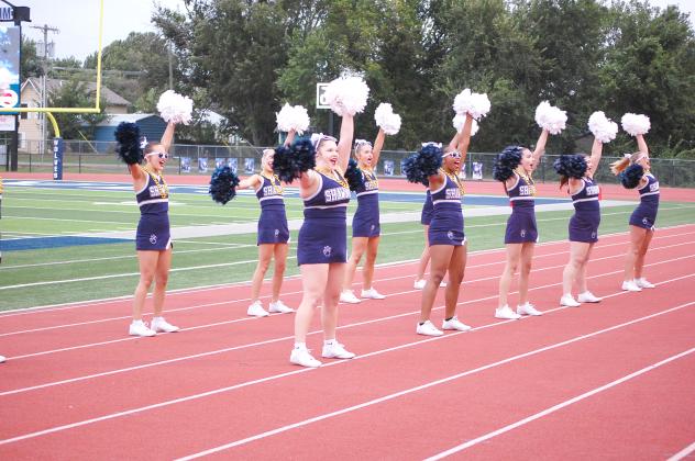 The SHS Cheerleaders pump up the crowd after a Wolves first down. Savannah Talton, Countywide &amp; Sun
