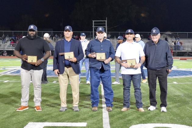 Gary Frazier ('07), Jay Seikell ('75), Dennis Brooks ('74), Justin Bedwell ('06) and Chuck Bowman (representing the late Dick Bowman, SHS Coach 1957-58) were inducted into the Shawnee High School Football Hall of Fame on Sept. 5 at the season-opening, home game. Julie Talton, Countywide &amp; Sun