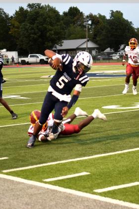 SHS's QB, Braylon Lassiter makes his way out of bounds.  The Shawnee Wolves won their season opener at home against PC North on Sept. 5 32-19 (last year PC North beat SHS 35-3 last season). Julie Talton, Countywide &amp; Sun