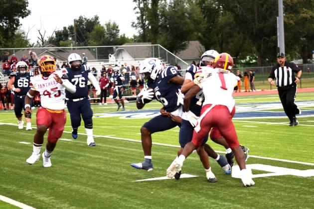 KD Palmer breaks through a Panther's tackle.  The Shawnee Wolves won their season opener at home against PC North on Sept. 5 32-19 (last year PC North beat SHS 35-3 last season). Julie Talton, Countywide &amp; Sun