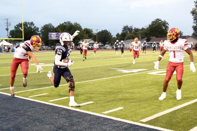 SHS's WR, Dillon Simmons balances the line for a first down. The Shawnee Wolves won their season opener at home against PC North on Sept. 5 32-19 (last year PC North beat SHS 35-3 last season). Julie Talton, Countywide &amp; Sun