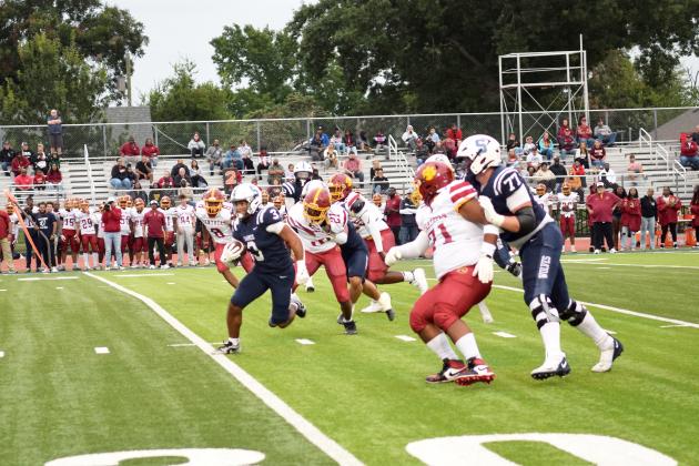 SHS's offensive line creates a hole for RB, Dayton McClendon to score the first touchdown from a hand-off at the 34 yard line. The Shawnee Wolves won their season opener at home against PC North on Sept. 5 32-19 (last year PC North beat SHS 35-3 last season). Julie Talton, Countywide &amp; Sun