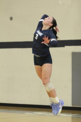 Shawnee sophomore Aubrey Smith serves during the Shawnee Volleyball Invitational Silver Bracket game, held at Shawnee Middle School on Sept. 20. The Gold Bracket games were played at Shawnee High School. The Lady Wolves won two games and lost three during the two-day tournament. Eight teams, including Tecumseh, participated.