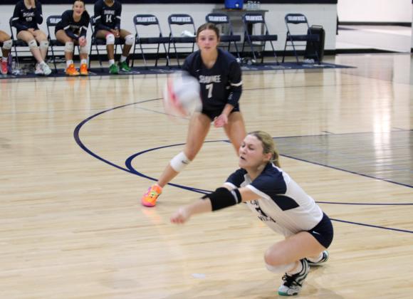 Shawnee senior and libero Ashlynn Chavez makes a save, as Reese Leone watches, during the home game with Del City on Aug. 28. The Lady Wolves won, 3-0. Their scores were 25-20, 25-18 and 25-11.