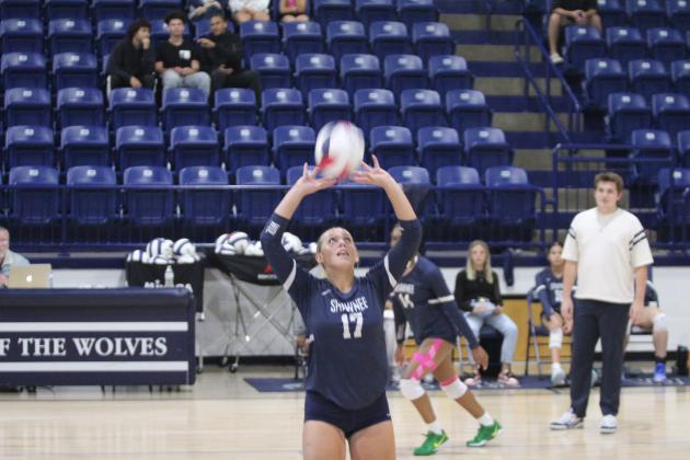 Shawnee sophomore Molly Megehee sets the ball during the home game with Del City on Aug. 28. The Lady Wolves won, 3-0. Their scores were 25-20, 25-18 and 25-11.