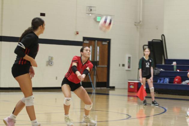 North Rock Creek Libero Jaynie Ford serves during the Shawnee Volleyball Invitational game with Shawnee on Sept. 20. NRC played in the Silver Bracket on Sat. The Lady Cougars won two games and lost three during the two-day tournament. In addition to Shawnee, they played Tecumseh, Cascia Hall and Cache.