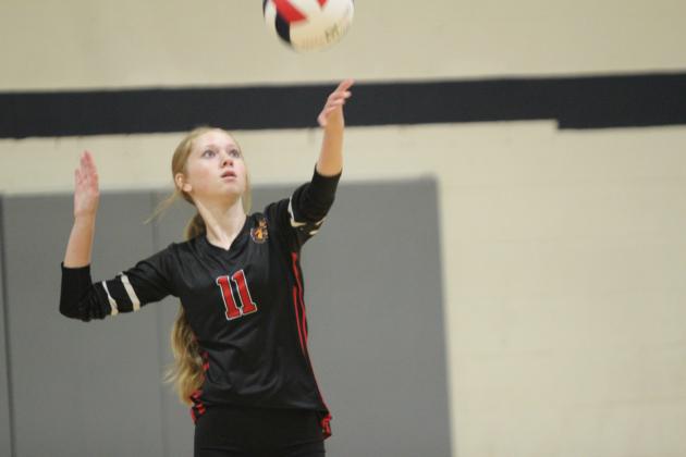 North Rock Creek's Liana LeClaire serves during the Shawnee Volleyball Invitational game with Shawnee on Sept. 20. NRC played in the Silver Bracket on Sat. The Lady Cougars won two games and lost three during the two-day tournament. In addition to Shawnee, they played Tecumseh, Cascia Hall and Cache.