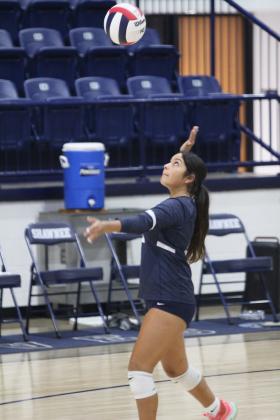 Shawnee freshman Khloe Smith concentrates on the ball while serving during the home game with Del City on Aug. 28. The Lady Wolves won, 3-0. Their scores were 25-20, 25-18 and 25-11.
