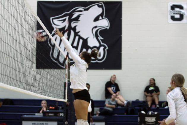 Tecumseh sophomore Aivah Dodgion makes a block during the Shawnee Volleyball Invitational Silver Bracket game against Harding Charter, held at Shawnee Middle School on Sept. 20. The Lady Savages won two games and lost three in the two-day tournament.