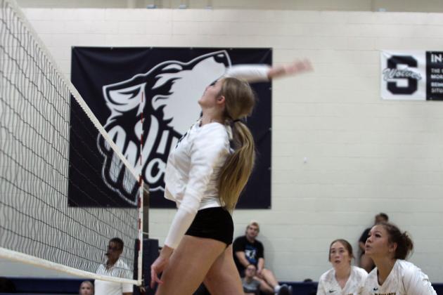 Tecumseh senior Kenadee Mason spikes the ball during the Shawnee Volleyball Invitational Silver Bracket game against Harding Charter, held at Shawnee Middle School on Sept. 20. The Lady Savages won two games and lost three in the two-day tournament.