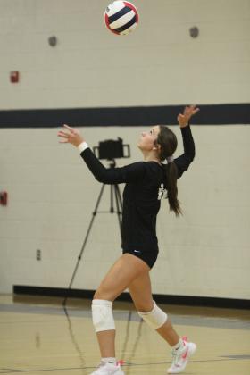 Tecumseh senior, libero Kayley Wood keeps her eye on the ball as she serves during the Shawnee Volleyball Invitational Silver Bracket game against Harding Charter, held at Shawnee Middle School on Sept. 20. The Lady Savages won two games and lost three in the two-day tournament.