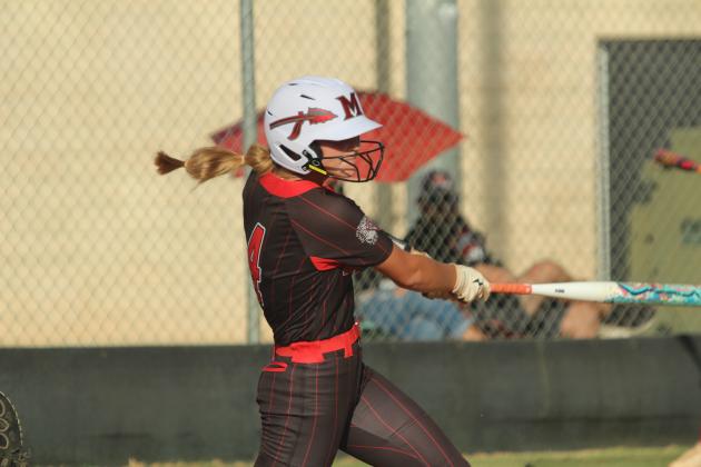 McLoud junior Ella Smith tags a triple and drives in two RBIs during the game at Tecumseh on Sept. 18. The Lady Redskins won, 3-7.