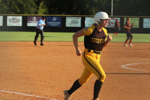 Tecumseh senior Steeli Mitchell sprints from third to home during the home game with McLoud on Sept. 18. The Lady Redskins won, 3-7.