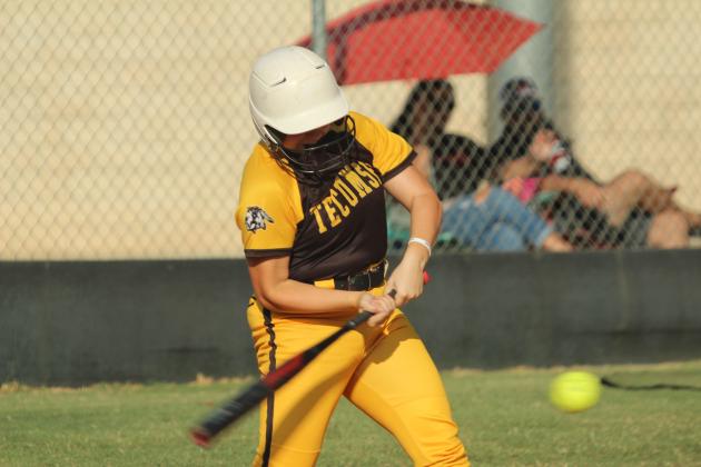 Tecumseh senior Maggie Wilson slaps a single during the home game with McLoud on Sept. 18. The Lady Redskins won, 3-7.