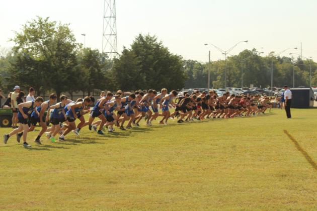 The high school boys begin their race during the North Canadian River Conference Cross Country Meet, held at Tecumseh High School on Sept. 16. The teams included Bethel, Harrah, Mount St. Mary, McLoud, North Rock Creek, Jones and Tecumseh. The top three teams were Jones, North Rock Creek, and McLoud. There were 67 high school boys total, and Harrah senior Tate Monden placed first with a time of 16:52.56, followed by NRC senior Raiden Simmons in second with 17:44.96.