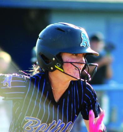 Right: Bethel senior Lilly Jordan runs after hitting a single and getting two RBIs in the Class 3A Regional Tournament.